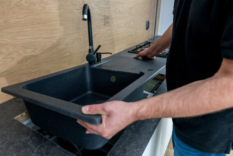 Sink replacement in Penrith - old sink being removed and replaced with a modern one